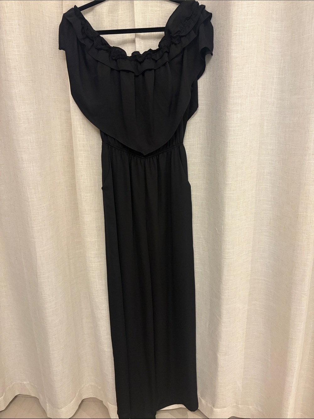 Tyche Black Off-Shoulder Jumpsuit with Ruffle Neckline